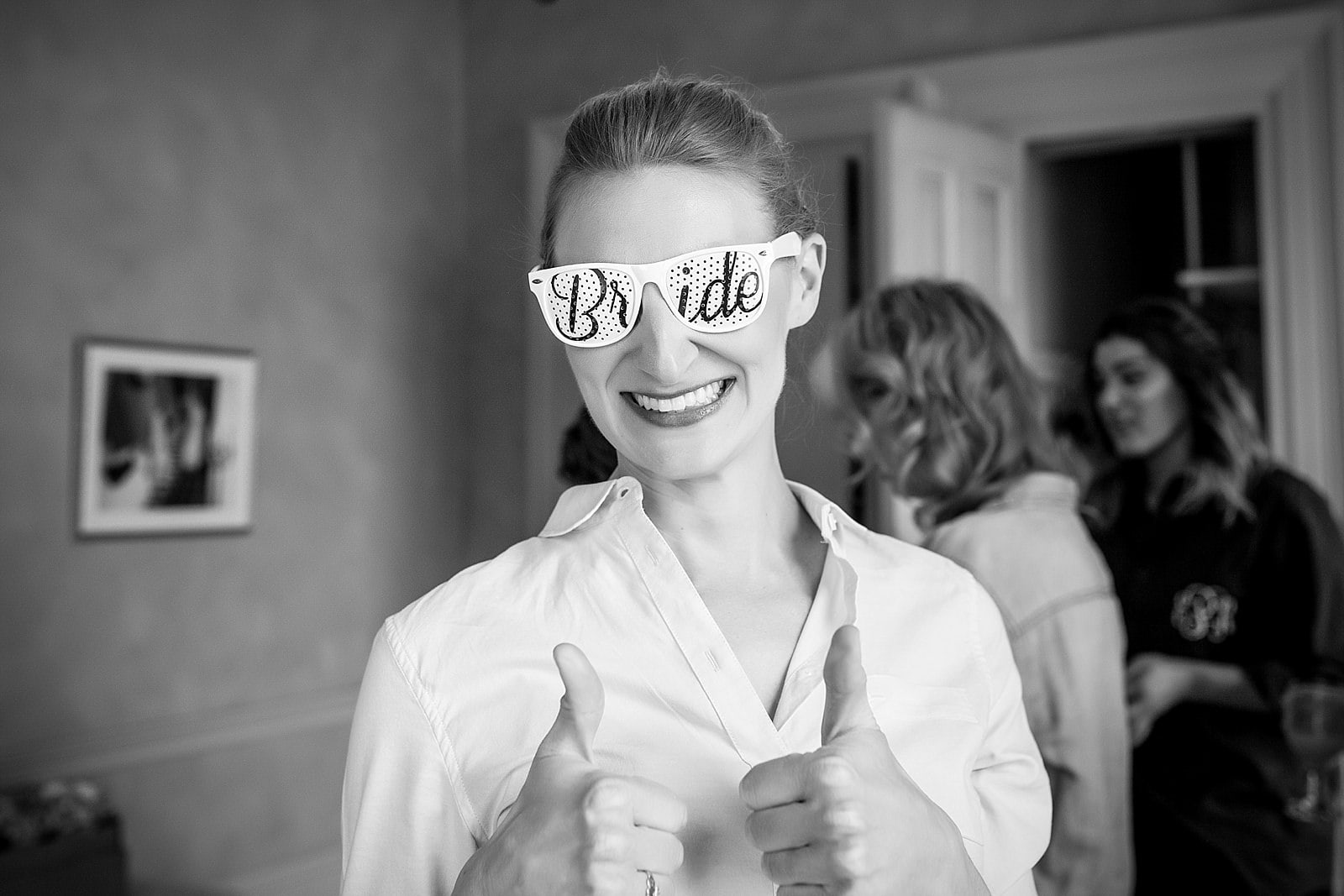 bride wearing "bride" sunglasses, black and white bridal portrait