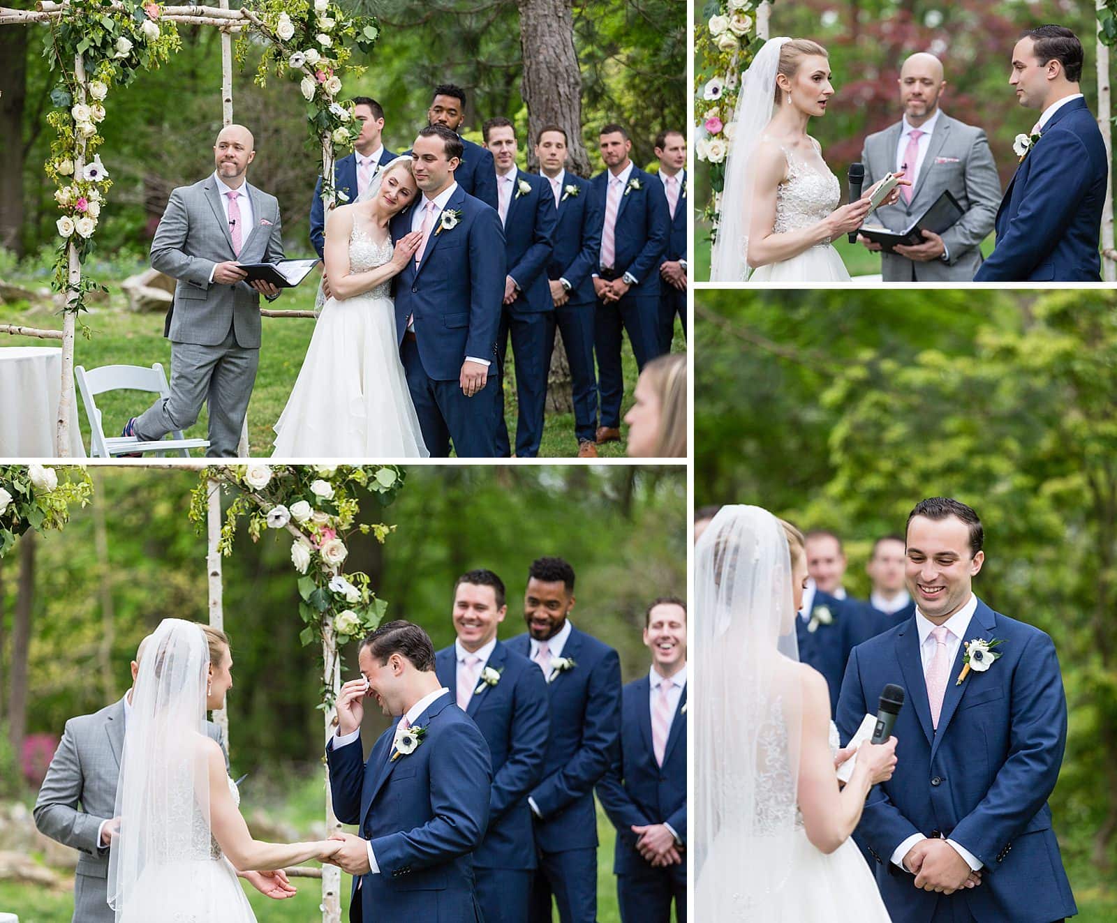 Bride and groom hugging during ceremony, groom crying and wiping tears 