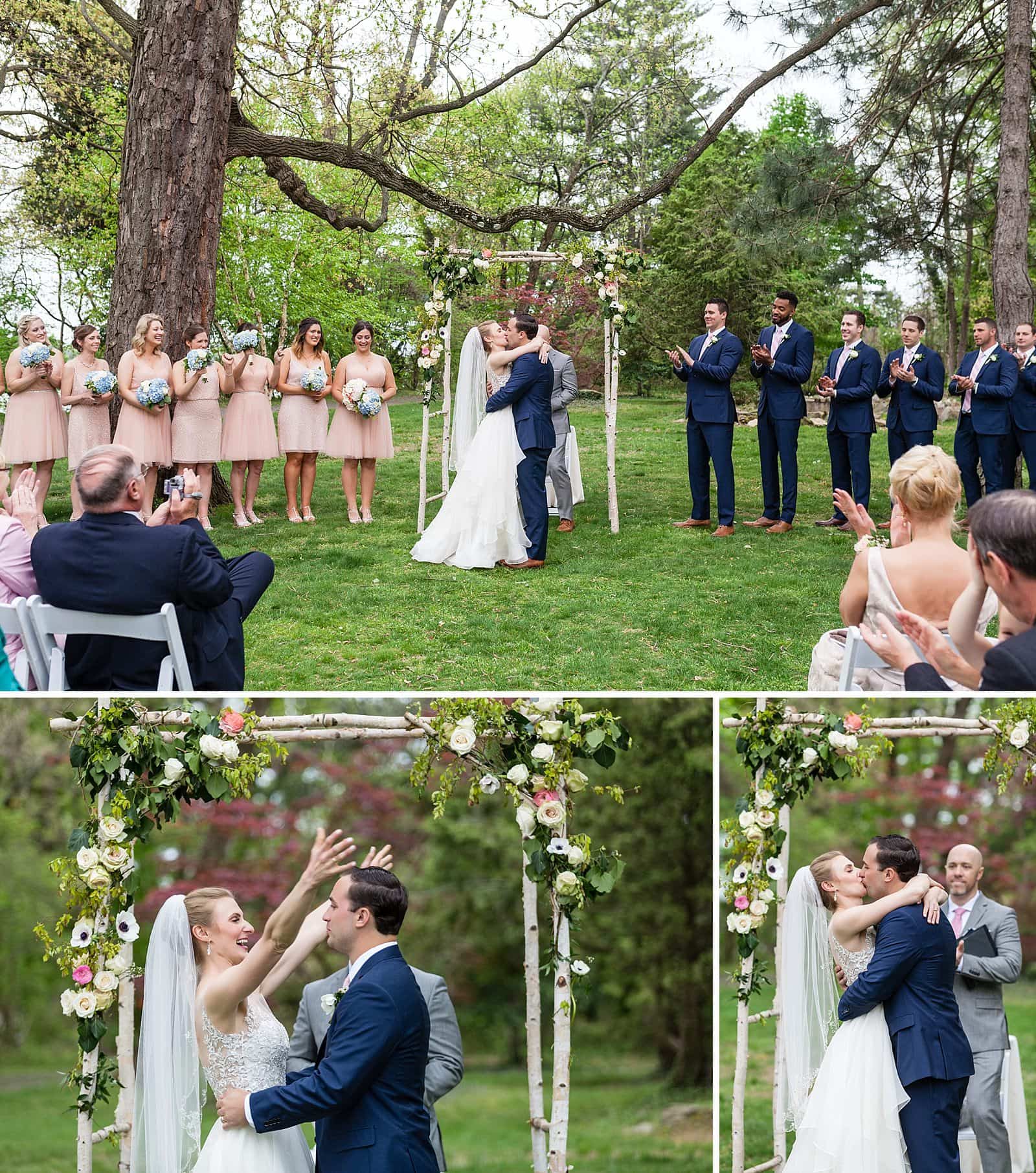 Bride and grooms first kiss, bride hugging groom, Glen Foerd Mansion wedding