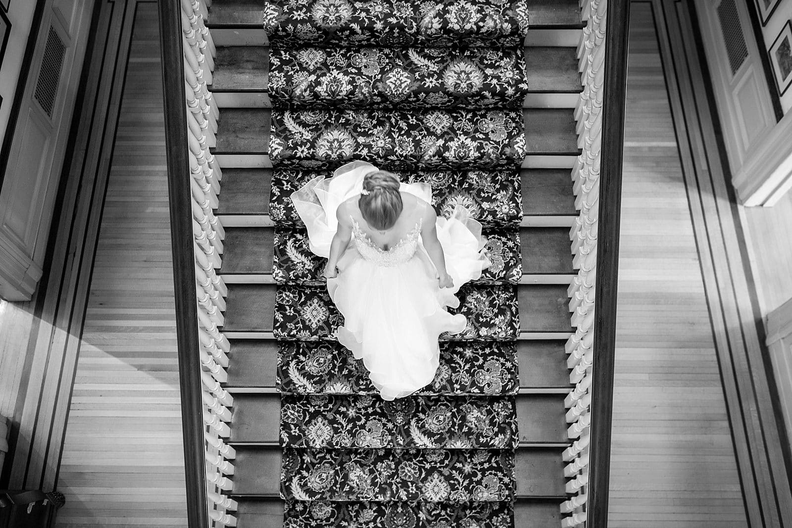 Black and white bridal portrait, bride walking down staircase, portrait from above, Glen Foerd Mansion wedding