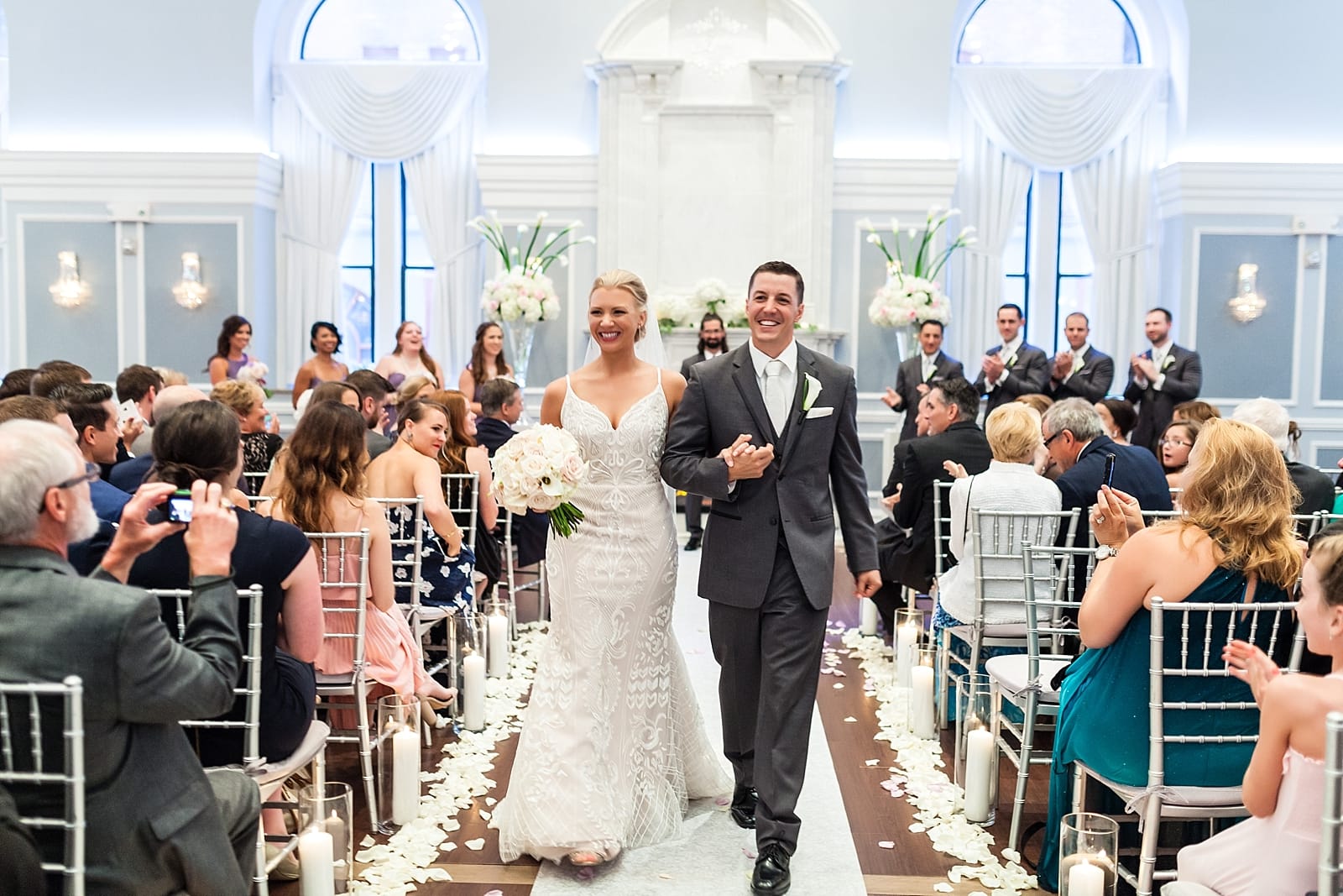 black and white, bride and groom, broad street, philadelphia wedding, recessional, arts ballroom wedding ceremony