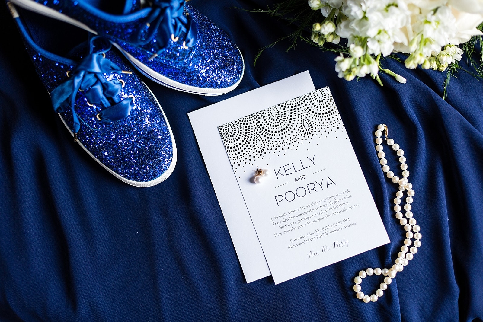 Blue Sequined Kate Spade Kids with bride's pearl necklace, wedding invitation inspiration