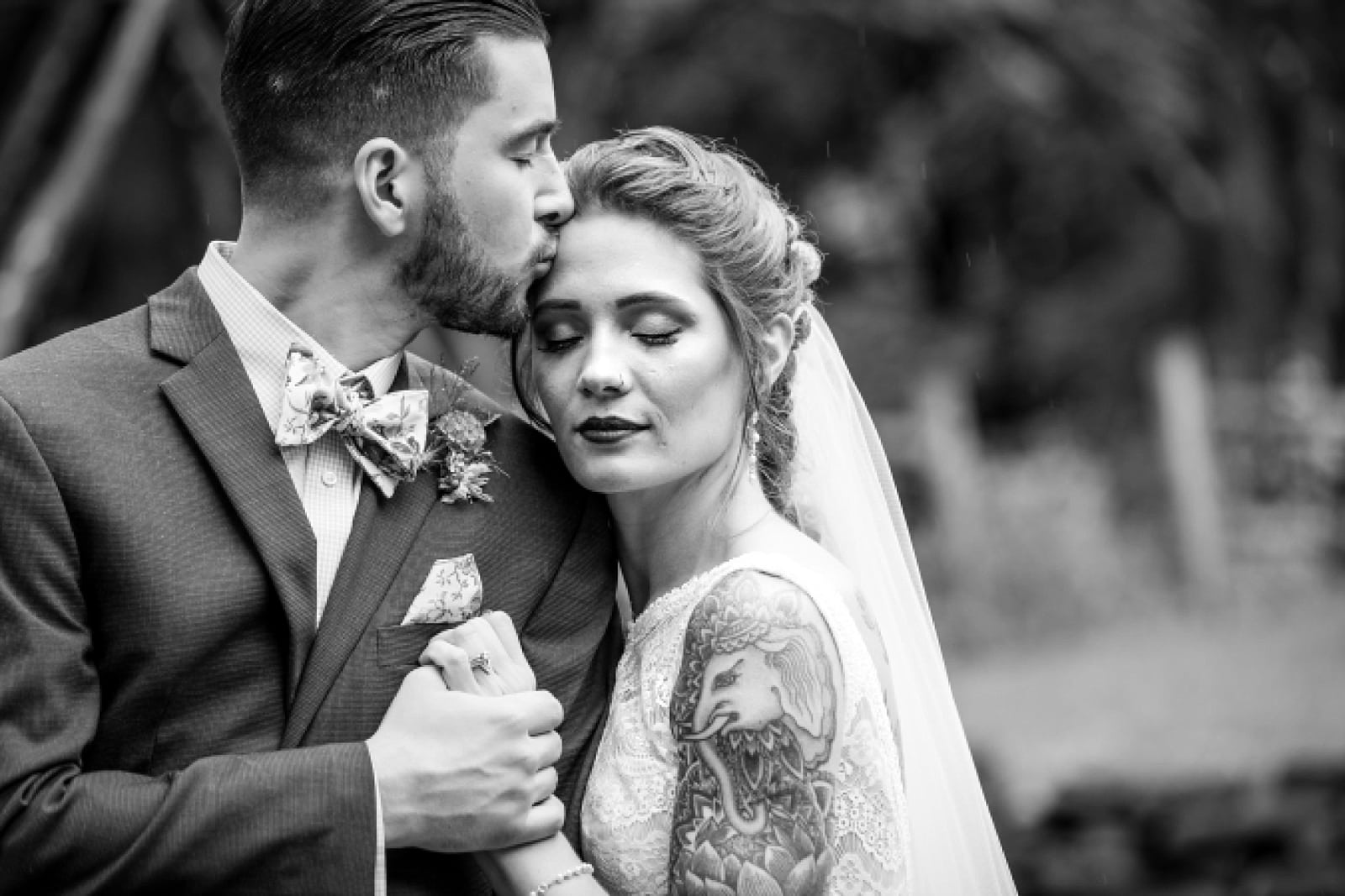 black & white wedding portraits of tattooed bride and groom at the Inn at Millrace Pond