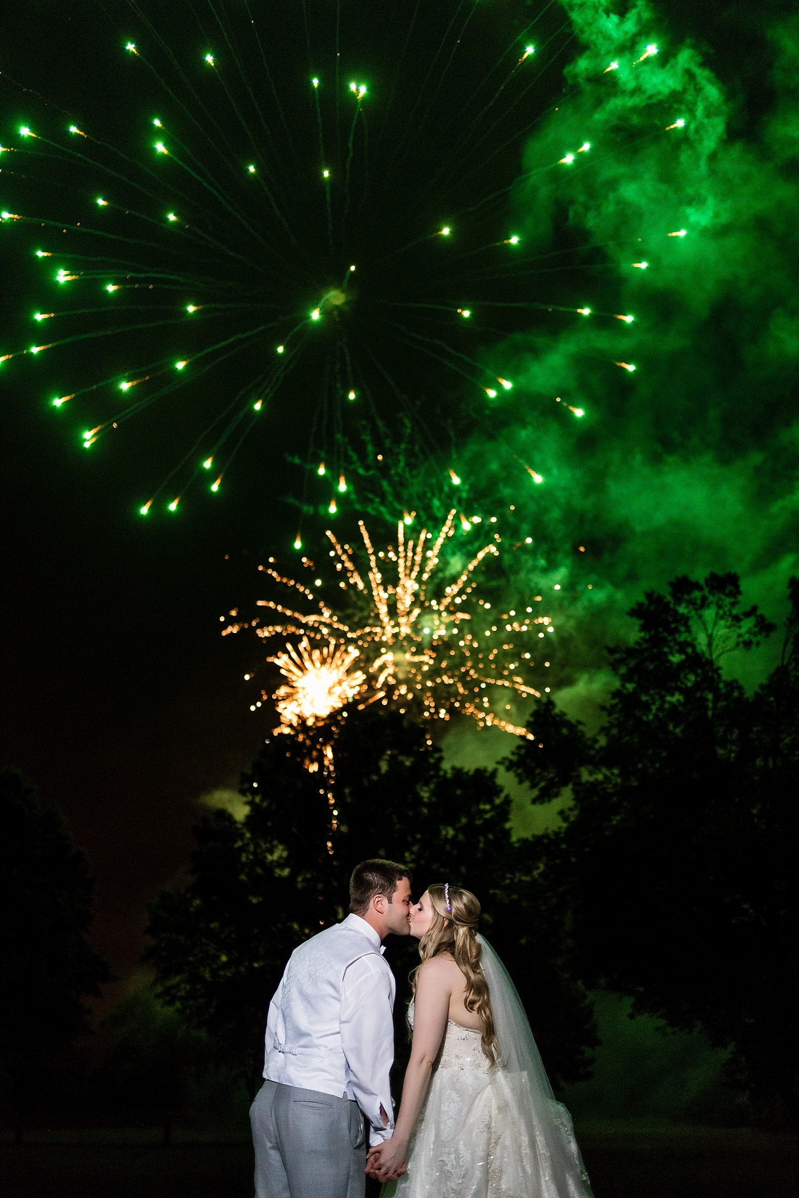 fireworks, wedding fireworks, fairytale wedding, couple kissing under fireworks, bride and groom portrait, wedding portrait 