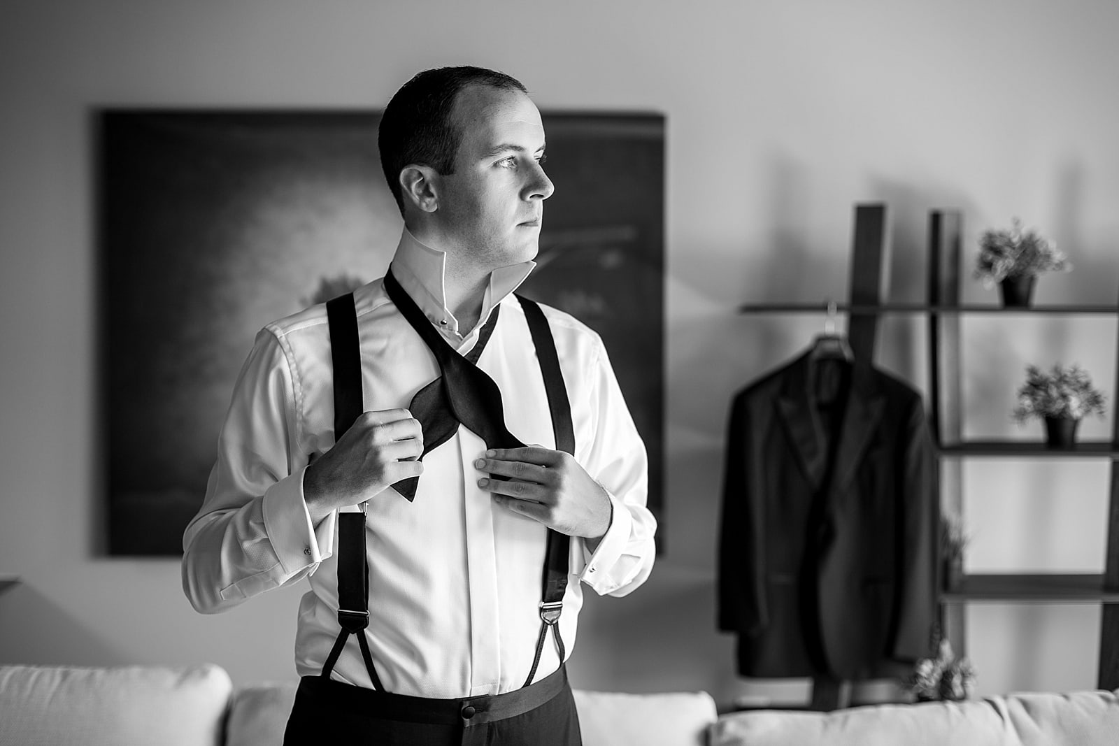 groom prep, groom getting ready, black and white groom portrait
