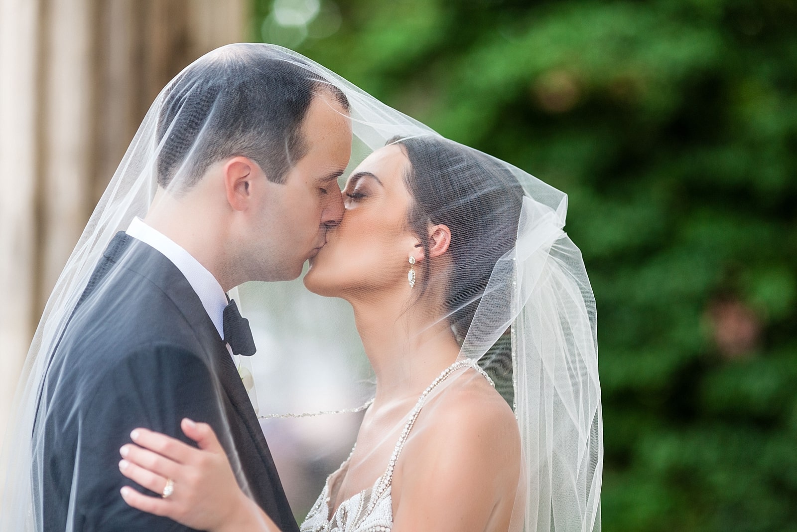 Bride and groom portrait, kissing under veil, under veil portrait, wedding portrait