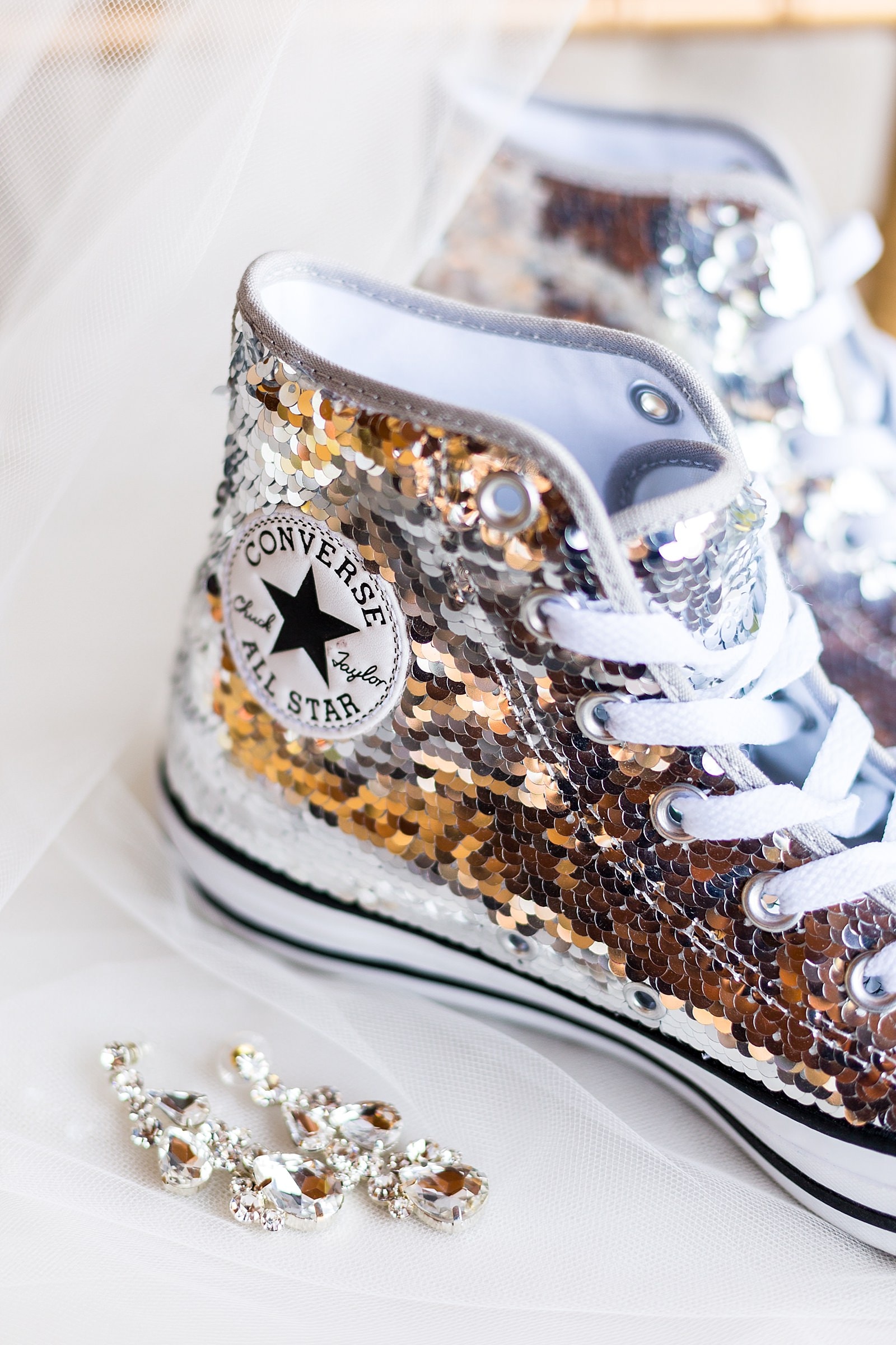 Bridal glitter converse sneakers with wedding veil and diamond earrings