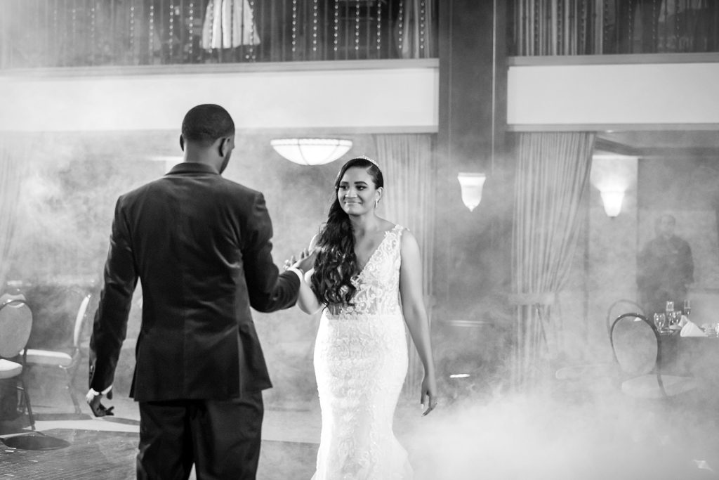 Bride & groom dance their first dance during their Collingswood Ballroom with smoke around them