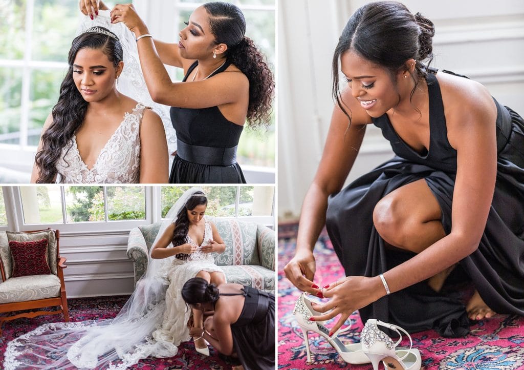 Bride's maid of honor helps put her veil into her hair and buckle up her Badgley Mischka shoes