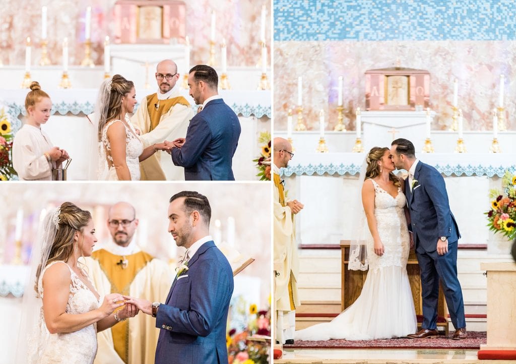 Bride & groom exchange rings, vows, & kisses during their catholic wedding ceremony at St Charles Borromeo