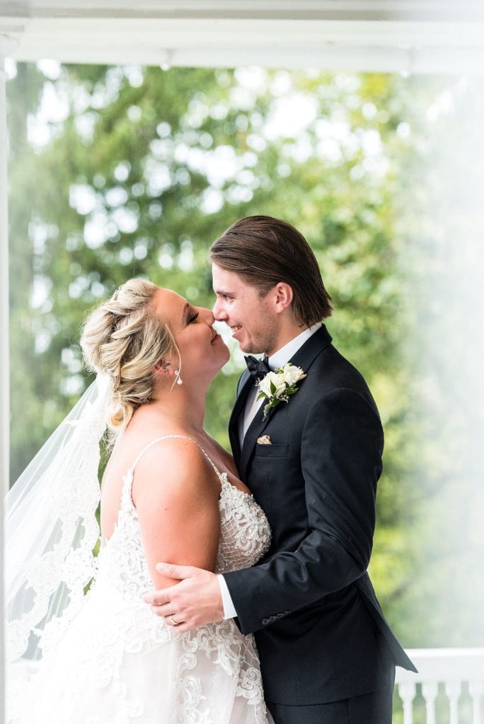 Bride & groom laugh together for a wedding photo at their John James Audubon Center wedding