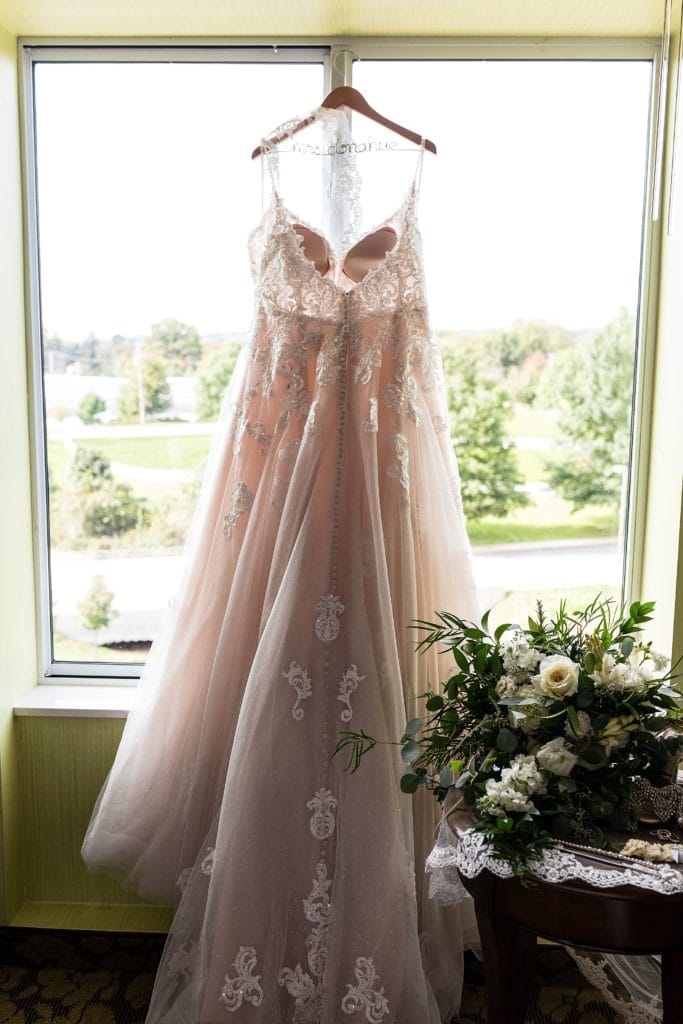 blush lace wedding dress on personalized hanger