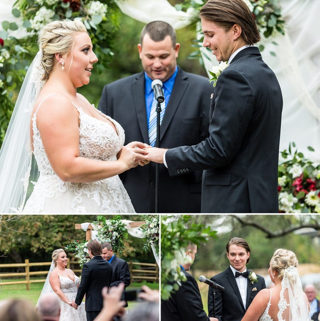 bride & groom exchange rings & vows under a ceremony arch draped with sheer fabrics, greenery, and floral arrangements during their John James Audubon Center wedding ceremony