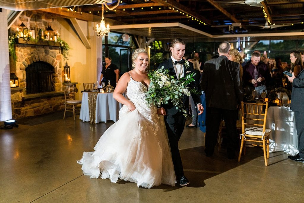 Bride & groom enter their Audubon center wedding reception