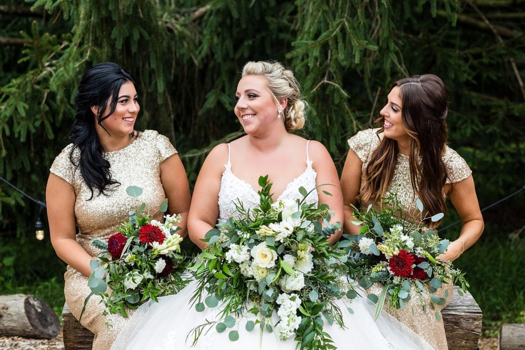 Bride with her two bridesmaids at her John James Audubon Center wedding