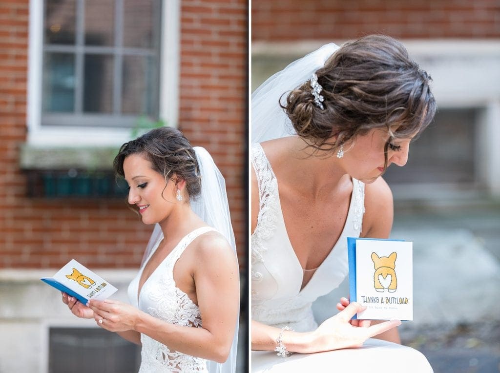 Bride holding a card from her dog that reads "Thanks a Buttload" during her first look with her dog