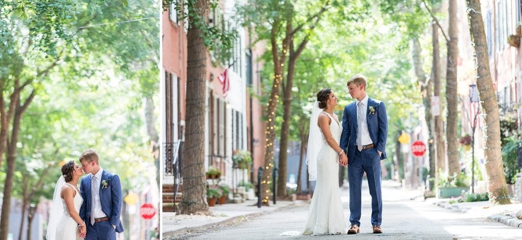 Bride & Groom hold hands for a wedding photo on Addison St in Philadelphia before their Kimmel Center Wedding