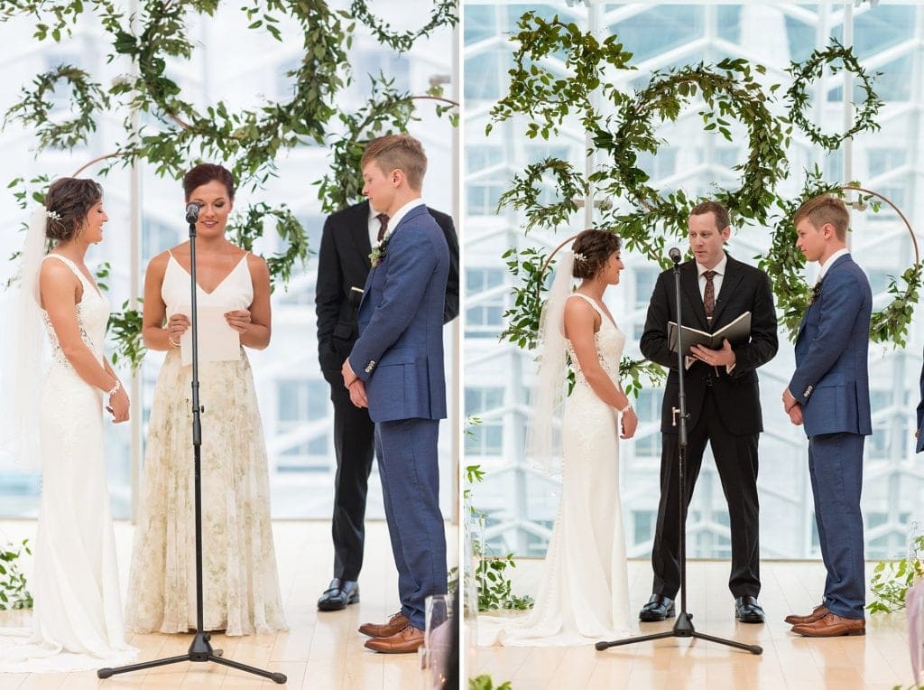 Readings take place in the industrial ceremony space for Kimmel Center wedding showing a ceremony backdrop of copper pipe and greenery wreaths