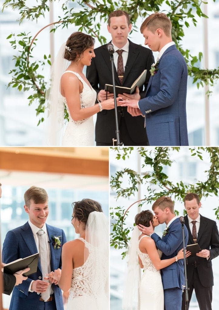 Wedding ceremony highlights take place in the industrial ceremony space for Kimmel Center wedding showing a ceremony backdrop of copper pipe and greenery wreaths