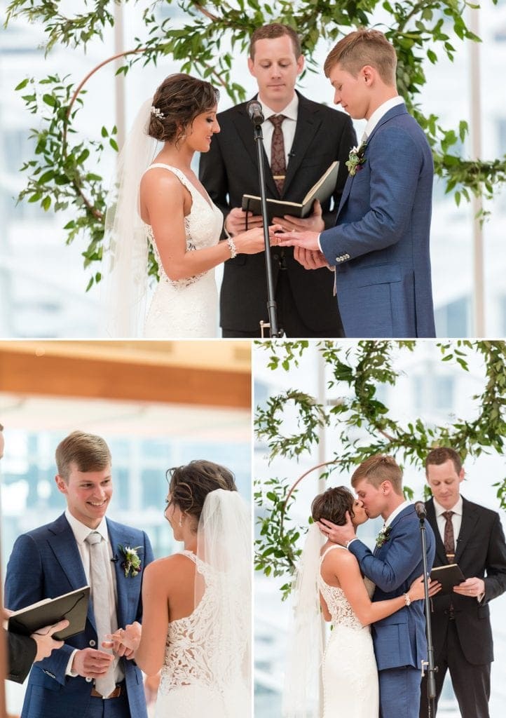 Wedding ceremony highlights take place in the industrial ceremony space for Kimmel Center wedding showing a ceremony backdrop of copper pipe and greenery wreaths