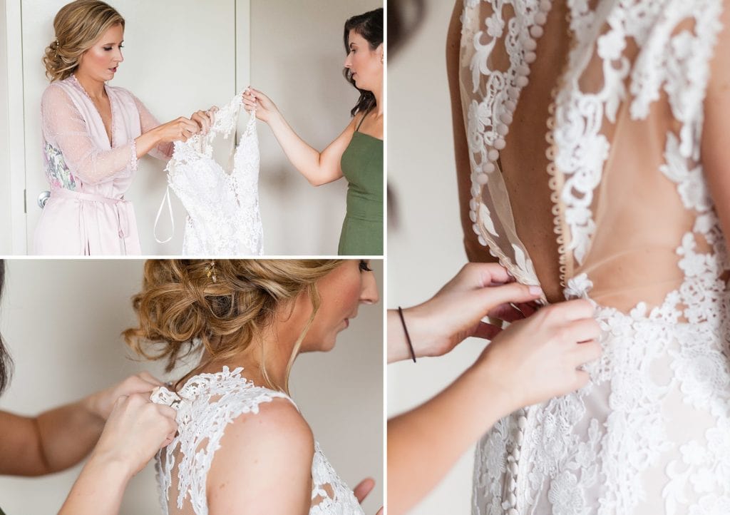 Bride getting into her wedding dress