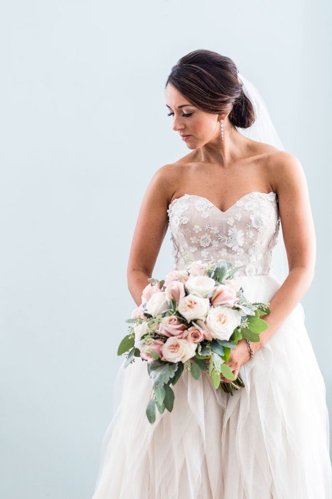 bridal portrait with a loose blush rose bouquet