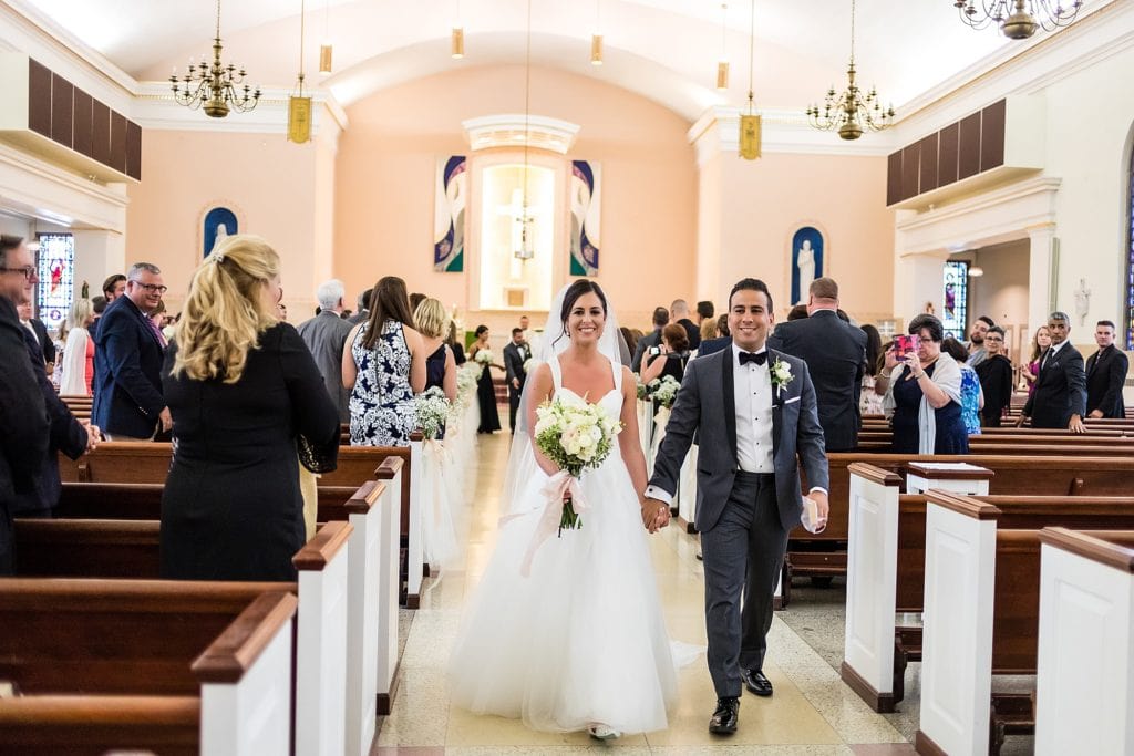 Bride & groom walking down the aisle