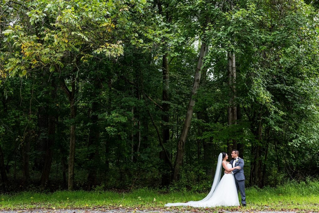 Bride & groom smile for a wedding photo before their Mendenhall Inn Wedding
