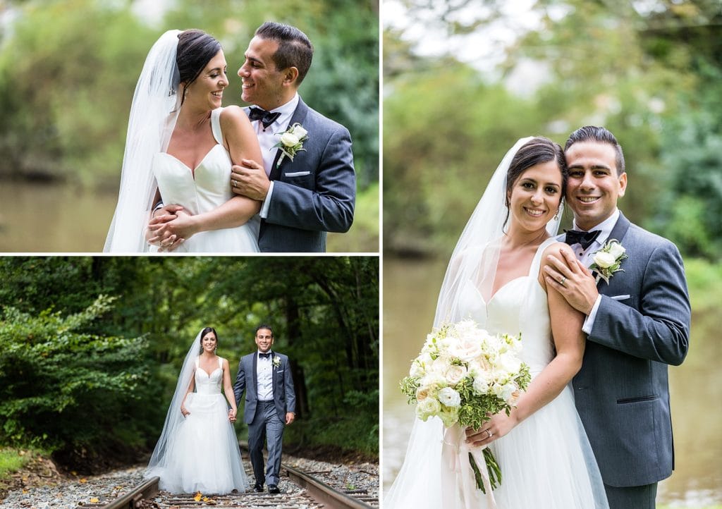 Groom embraces bride from behind and they walk along the abandoned railway tracks behind the Mendenhall Inn