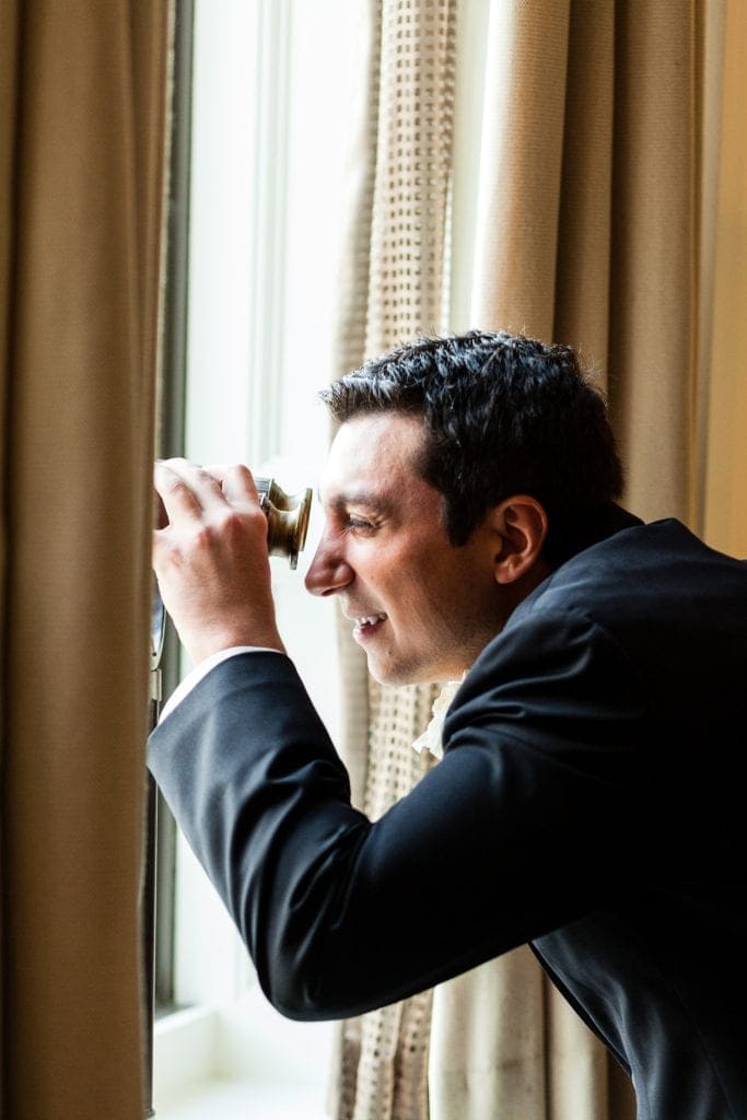 groom looking out window, groom