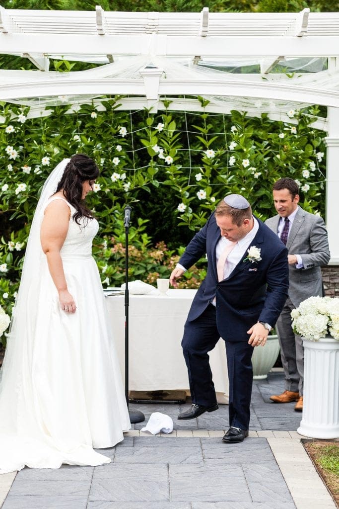 Jewish wedding ceremony, getting married, bride and groom, groom breaking glass