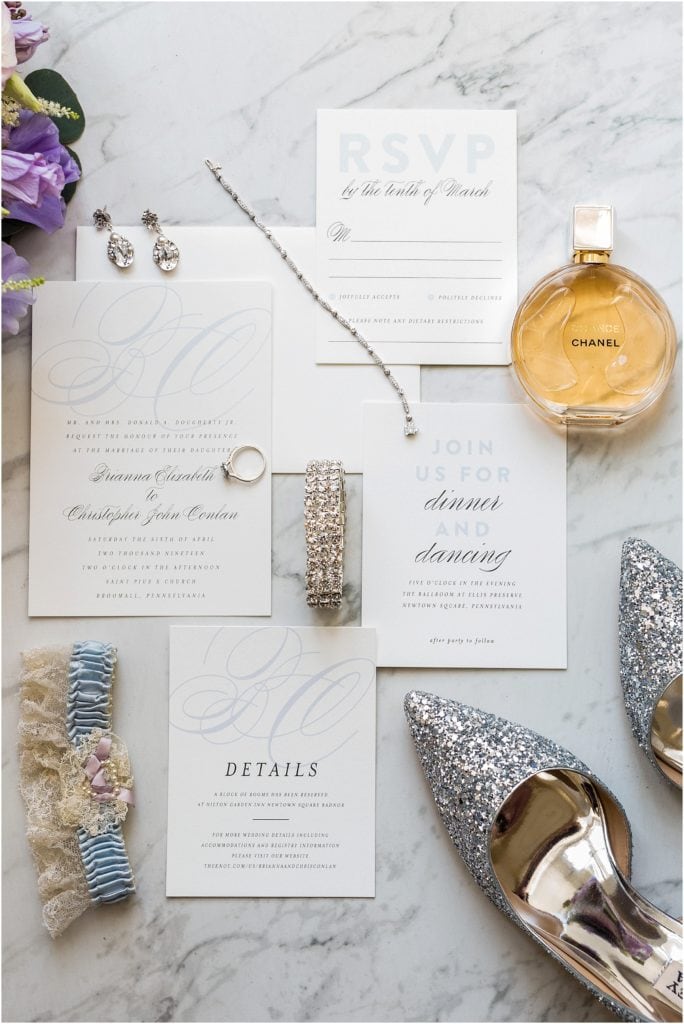 Elegant wedding invites styled with bridal accessories and Badgley Mischka shoes | Ashley Gerrity Photography