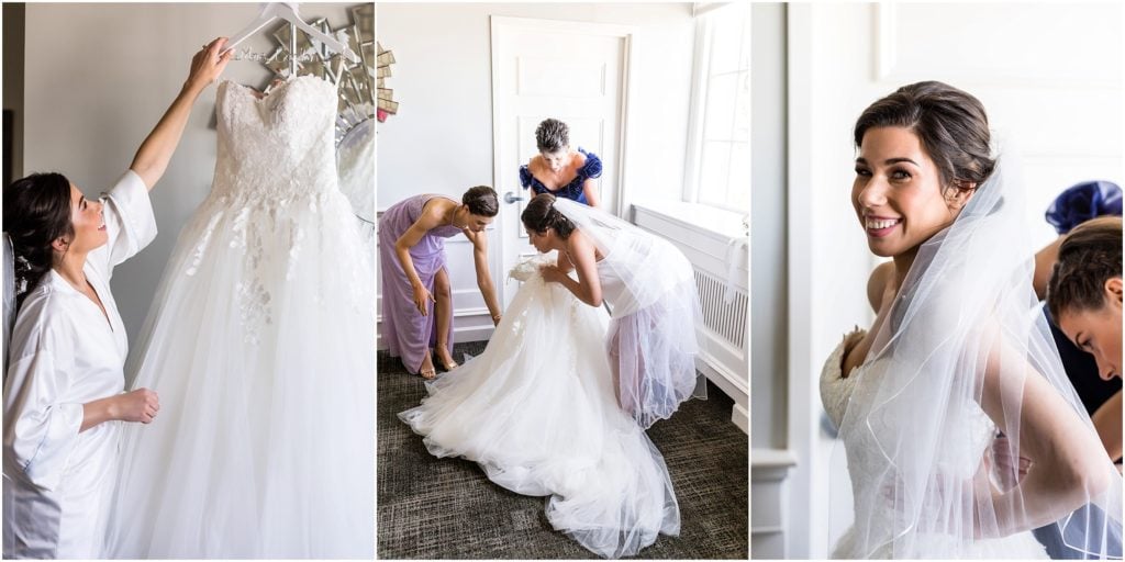 Excited bride being helped into her Pronovias wedding dress by bridesmaids and family | Ashley Gerrity Photography