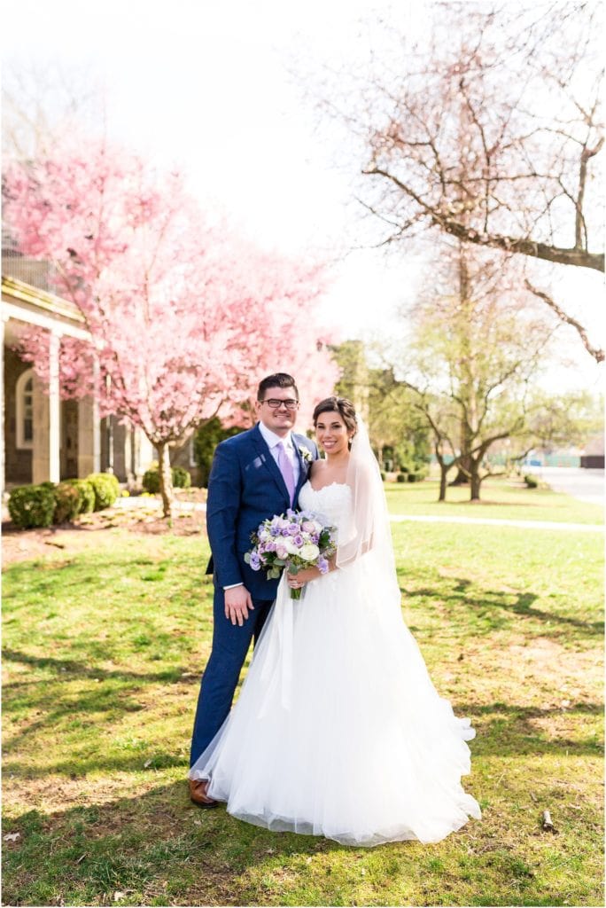 Bride and Groom portrait surrounded by fresh spring blossoms | Ashley Gerrity Photography www.ashleygerrityphotography.com