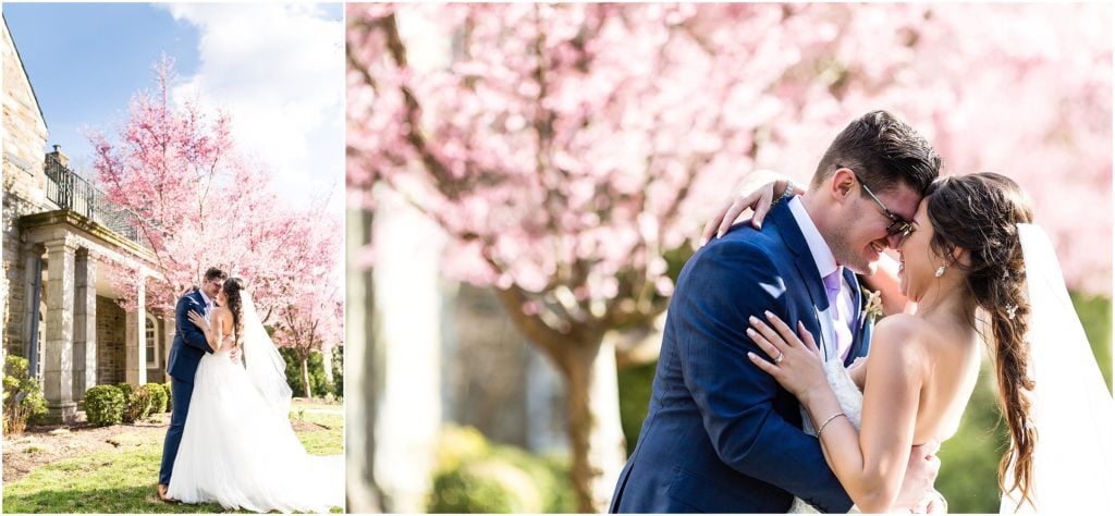 Bride in Pronovias dress sharing a kiss with her new husband surrounded by spring blossoms | Ashley Gerrity Photography www.ashleygerrityphotography.com