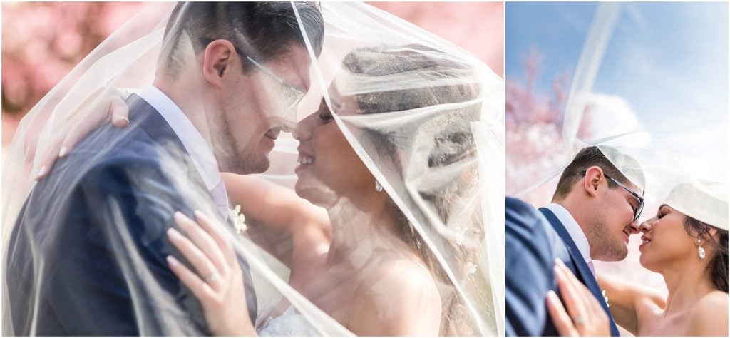 Bride in Pronovias dress sharing tender moments with her new husband surrounded by spring blossoms | Ashley Gerrity Photography www.ashleygerrityphotography.com