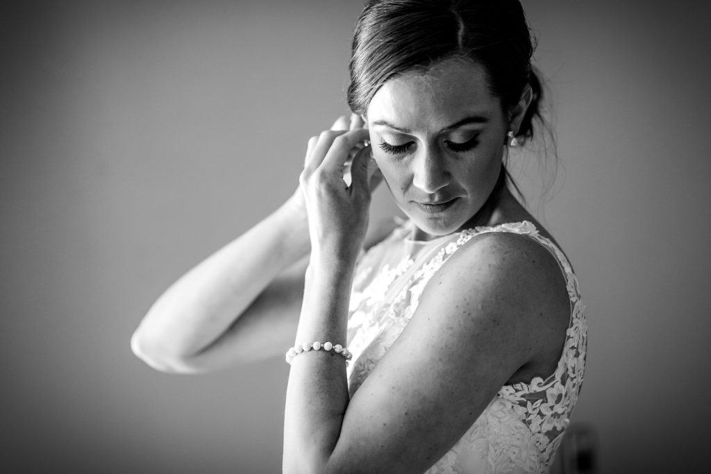 Bride putting the finishing touches to her wedding day look | Ashley Gerrity Photography www.ashleygerrityphotography.com