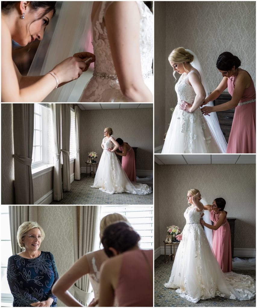 Maid of honor helps bride put on her Maggie Sottero dress at Union League Golf Club Wedding | Ashley Gerrity Photography www.ashleygerrityphotography.com