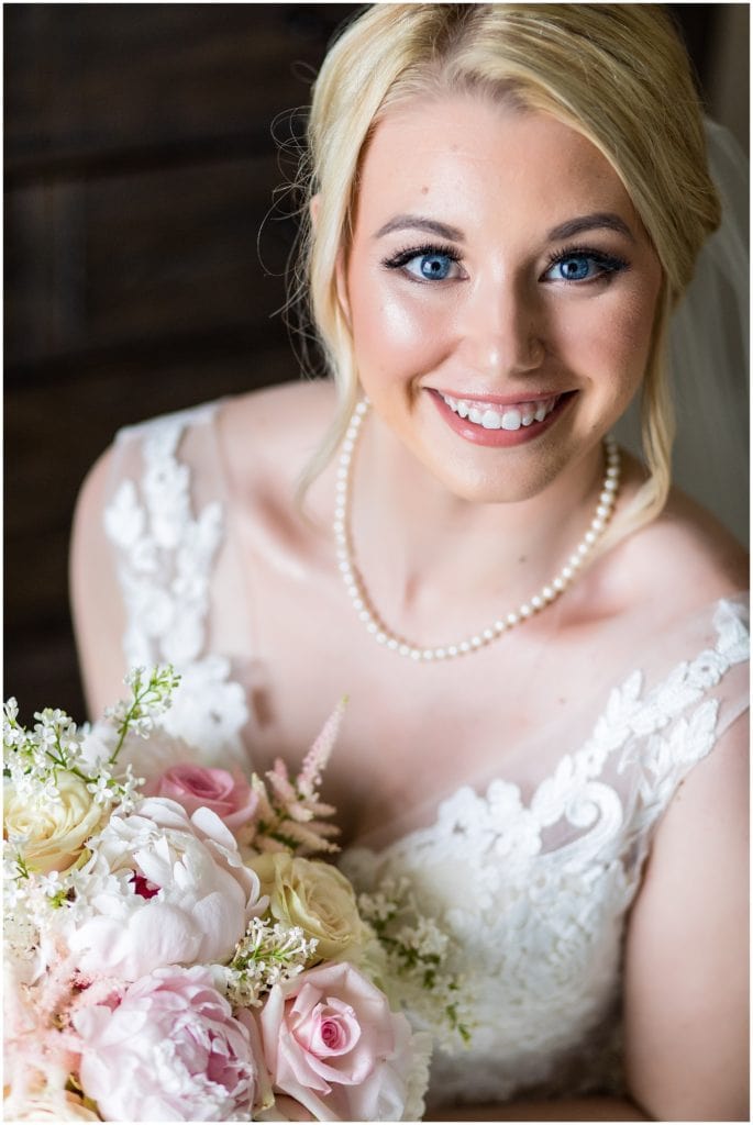 Portrait of bride in Maggie Sottero dress and flowers by Mark Bryan Floral Design at Union League Golf Club Wedding | Ashley Gerrity Photography www.ashleygerrityphotography.com