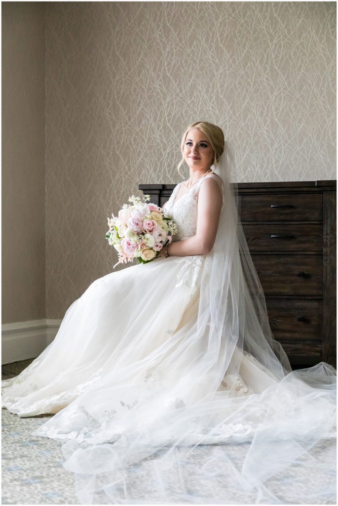 Portrait of bride in Maggie Sottero dress and flowers by Mark Bryan Floral Design at Union League Golf Club Wedding | Ashley Gerrity Photography www.ashleygerrityphotography.com