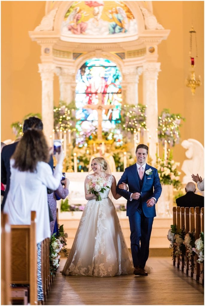 Newlyweds make their way back up the aisle | Ashley Gerrity Photography www.ashleygerrityphotography.com