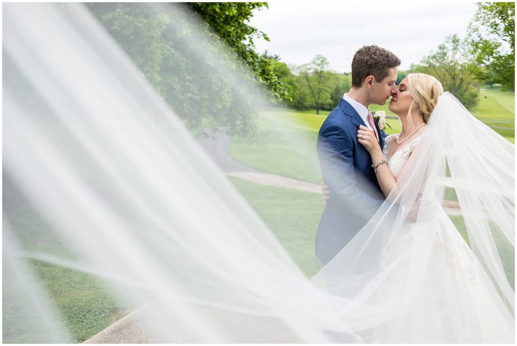 Bride and groom share a kiss at Union League Golf Club Wedding | Ashley Gerrity Photography www.ashleygerrityphotography.com