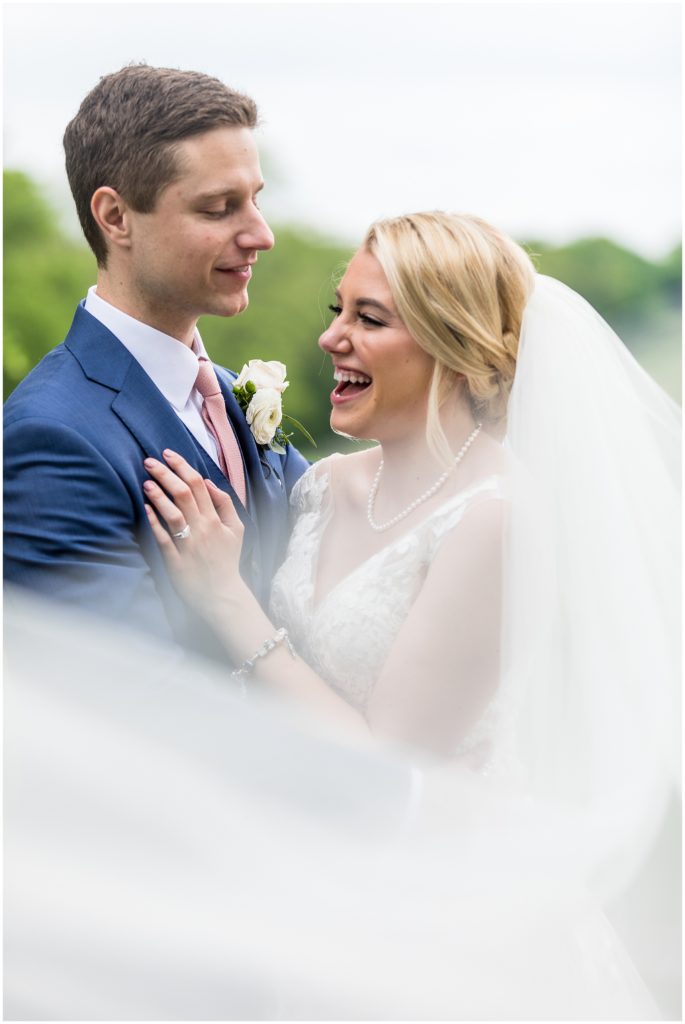 Bride and groom laughing together at Union League Golf Club Wedding | Ashley Gerrity Photography www.ashleygerrityphotography.com