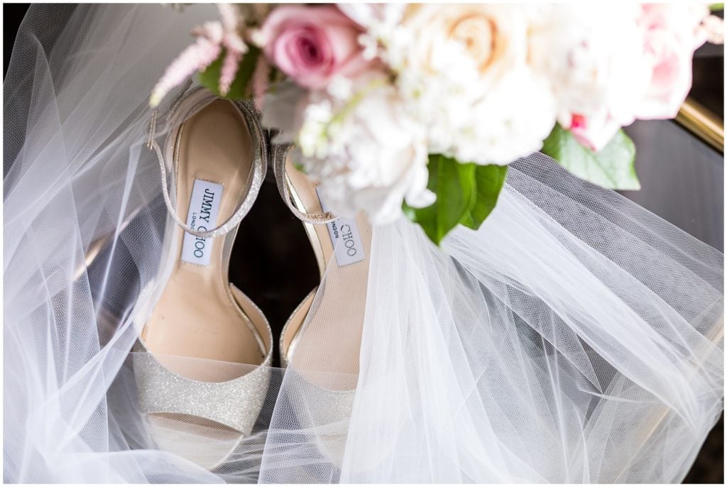 Brides veil and Bouquet by Mark Bryan Floral Designs surrounding Jimmy Choo bridal shoes | Ashley Gerrity Photography www.ashleygerrityphotography.com