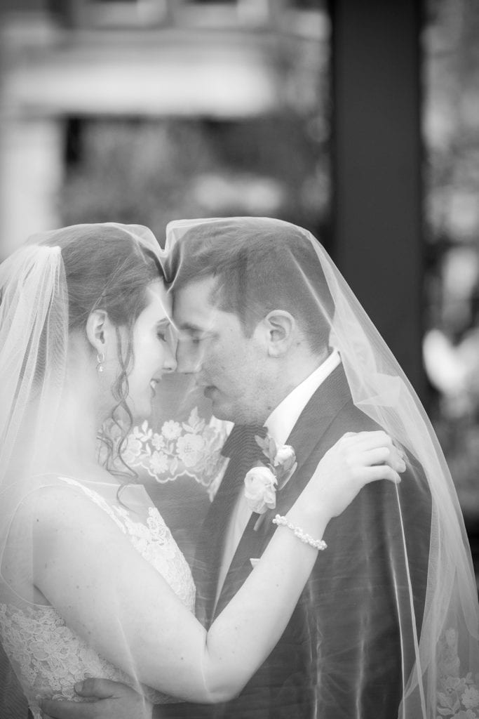 Under the veil bride and groom portraits Radnor Hotel Wedding | www.ashleygerrityphotography.com