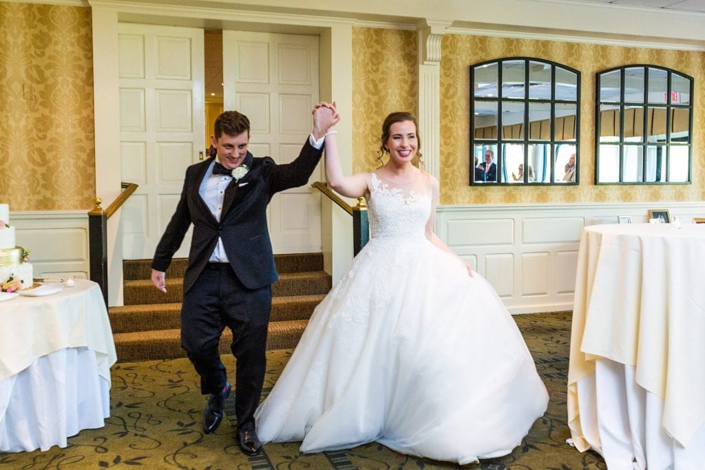 Bride and groom make an entrance at Radnor Hotel Wedding | www.ashleygerrityphotography.com