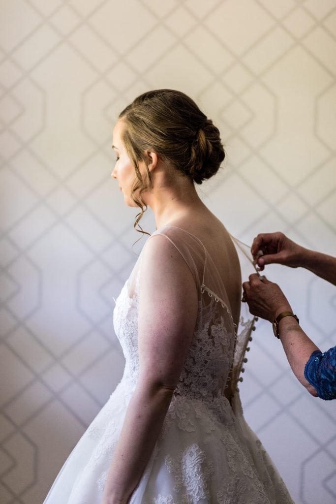 Bride being helped into her Anne Barge Dress from Love Couture Bridal | Ashley Gerrity Photography www.ashleygerrityphotography.com