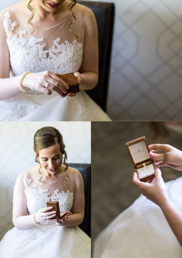 Bride opening a gift from the groom Portrait of bride in Anne Barge dress with Leigh Florist bouquet | Ashley Gerrity Photography www.ashleygerrityphotography.com