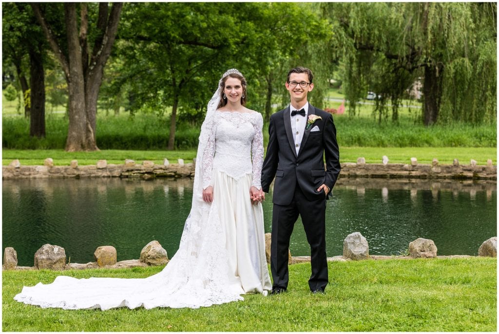 outdoor full length portrait of bride and groom in the Allentown Rose Garden