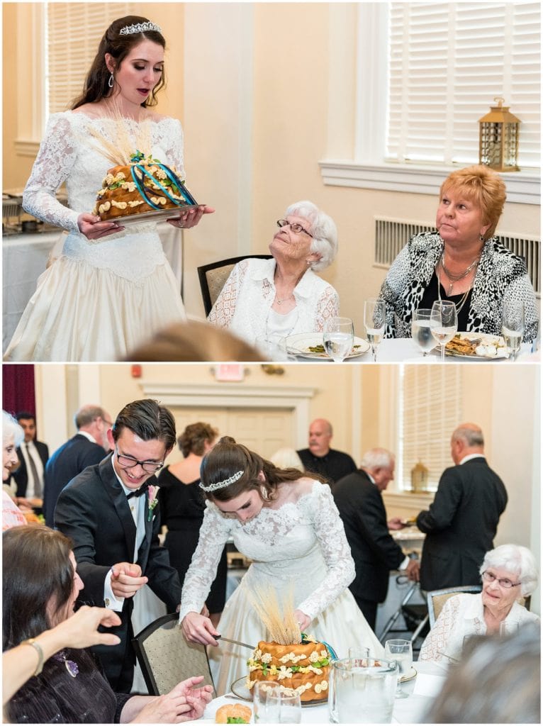 bride and groom sharing traditional Ukrainian Korovai wedding bread with their guests